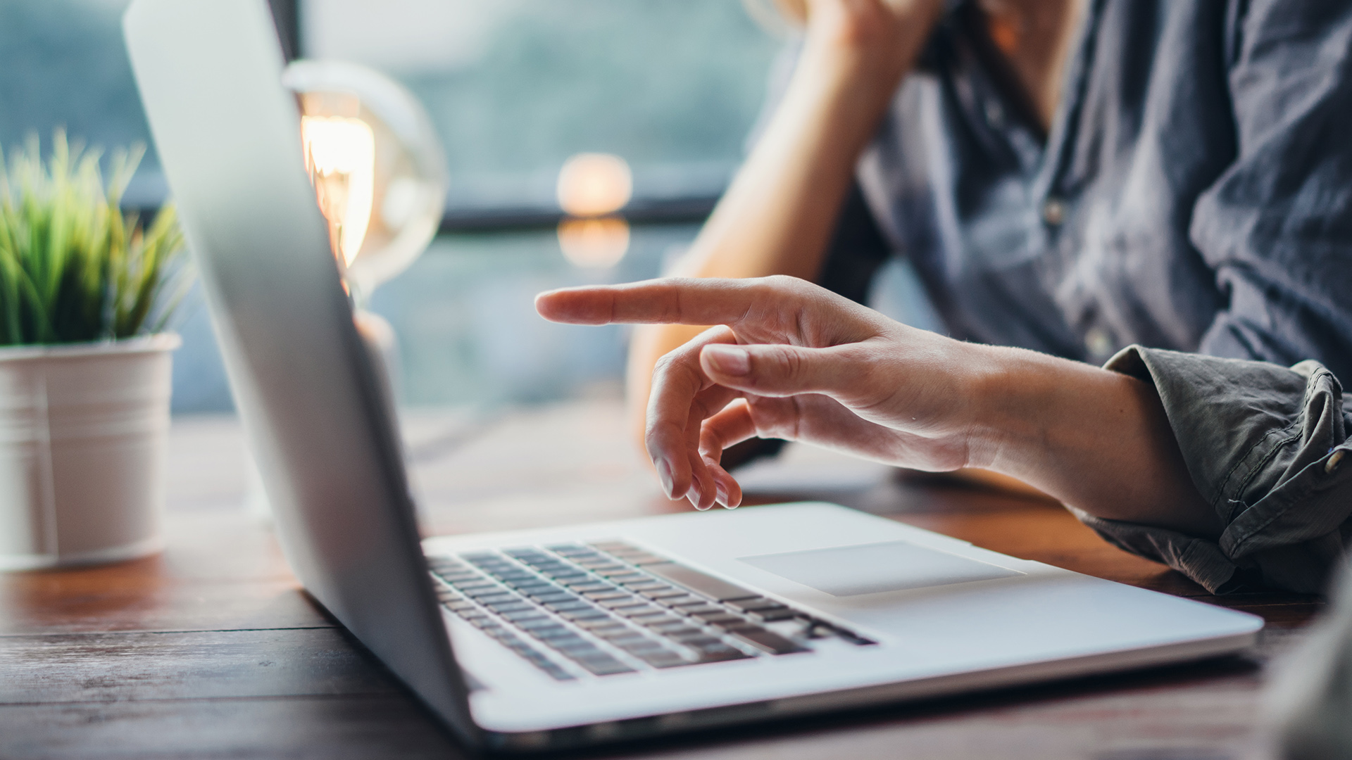Laptop screen displaying the Verimpact ESG platform dashboard. The interface shows company sustainability metrics including stakeholder and materiality status with a circular progress chart, company member bar chart, and data collection indicators for environmental, social, and governance categories.
